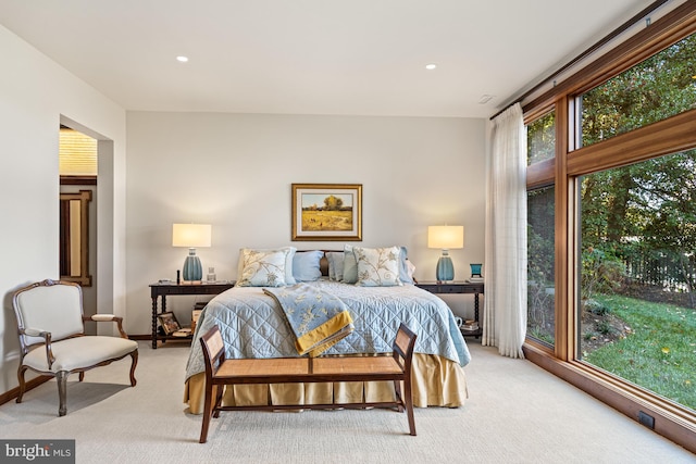 bedroom with light colored carpet