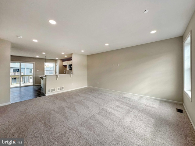 unfurnished living room with carpet