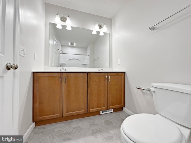 bathroom with tile patterned floors, toilet, and vanity