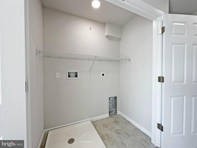 clothes washing area with electric dryer hookup, hookup for a washing machine, and light tile patterned floors