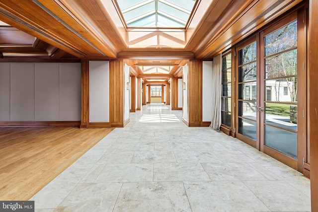 10111 Iron Gate Rd, Potomac, MD 20854 - hallway featuring light tile floors, coffered ceiling, a skylight, and ornamental molding