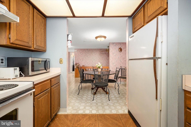 kitchen with light tile floors and white appliances