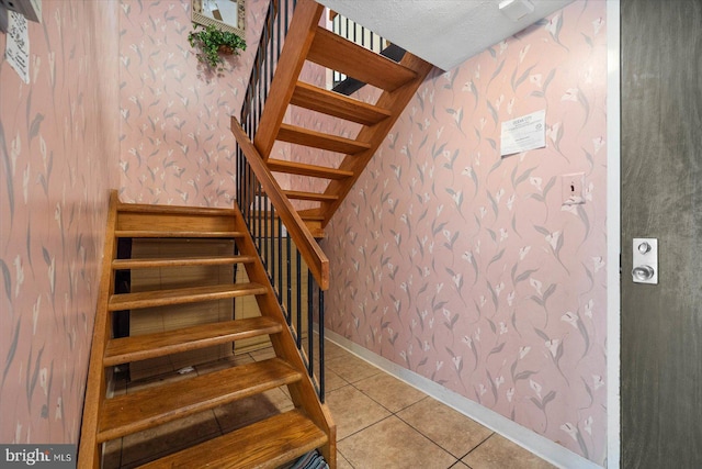 stairs featuring light tile floors