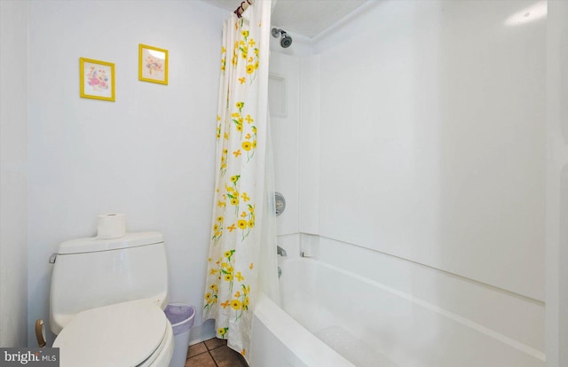 bathroom with toilet, tile flooring, and shower / bath combo with shower curtain