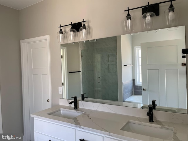 bathroom with independent shower and bath and dual bowl vanity