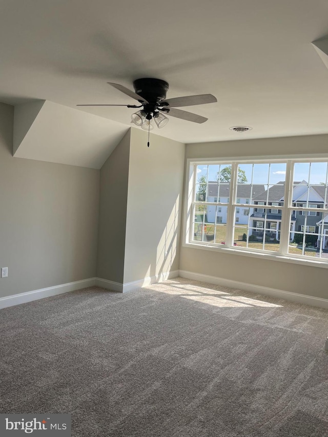 interior space with ceiling fan