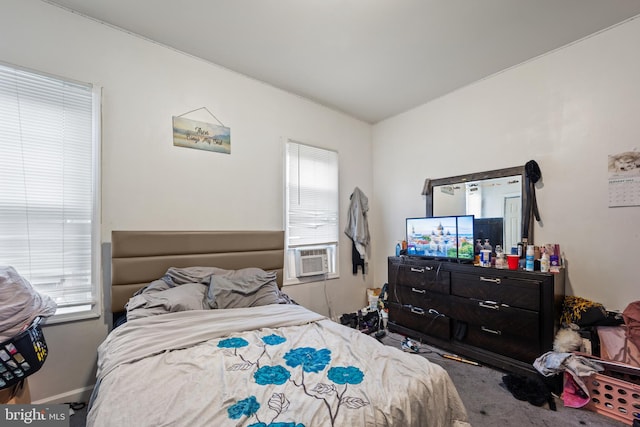 bedroom with carpet flooring and multiple windows