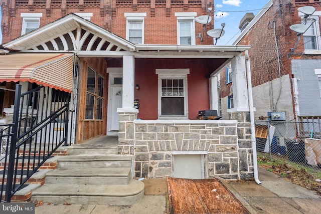 view of front of house with central air condition unit and covered porch