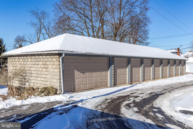 view of snow covered garage