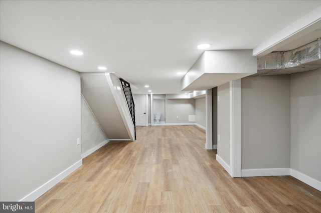 basement featuring light hardwood / wood-style flooring