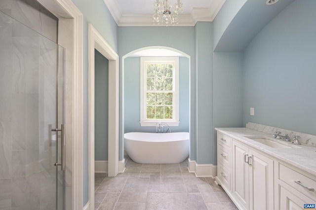 bathroom featuring crown molding, tile floors, vanity, an inviting chandelier, and independent shower and bath