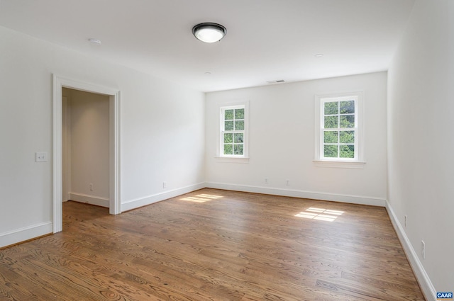 spare room featuring hardwood / wood-style flooring