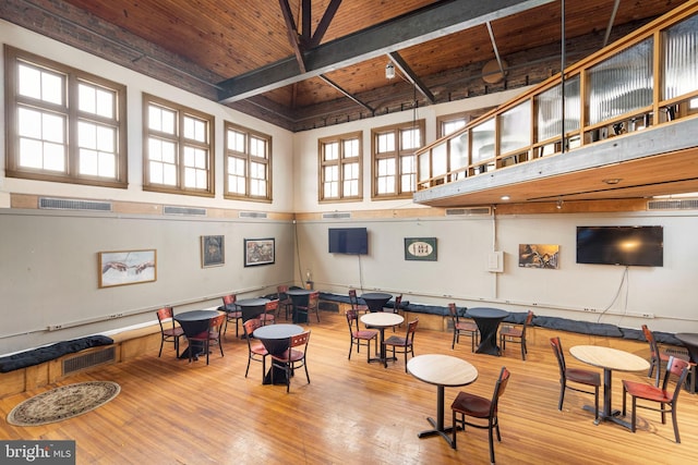 interior space with wooden ceiling and light wood-type flooring