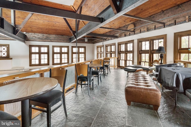 dining room featuring french doors, beam ceiling, and wooden ceiling