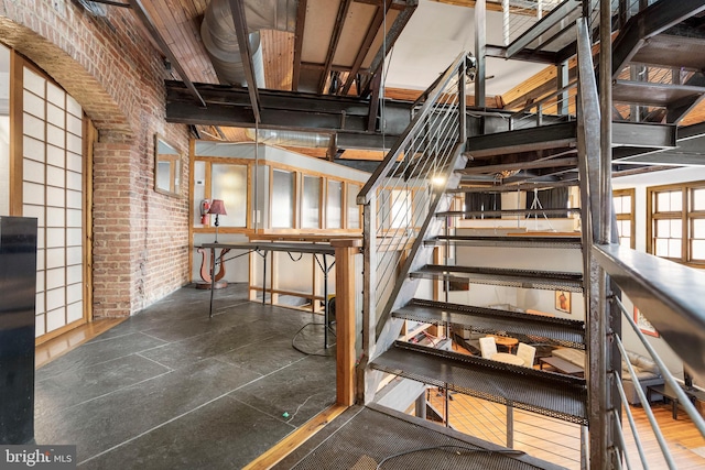 staircase with brick wall