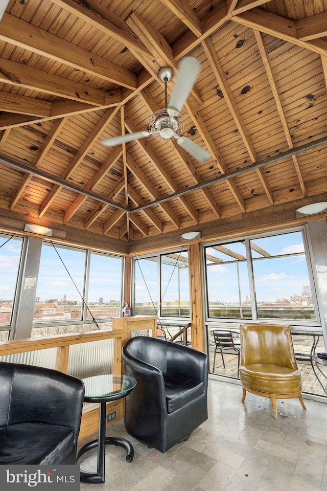 unfurnished sunroom with wooden ceiling, ceiling fan, vaulted ceiling with beams, and a wealth of natural light