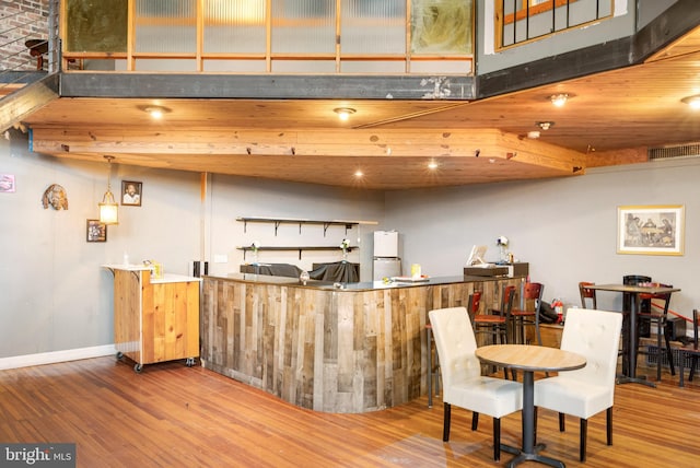 interior space featuring white refrigerator and wood-type flooring