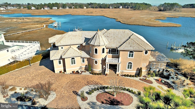 birds eye view of property with a water view