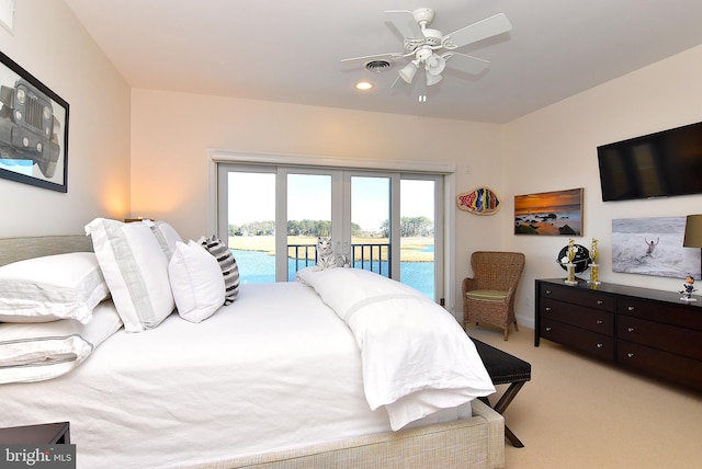 bedroom with ceiling fan, access to outside, light carpet, and french doors