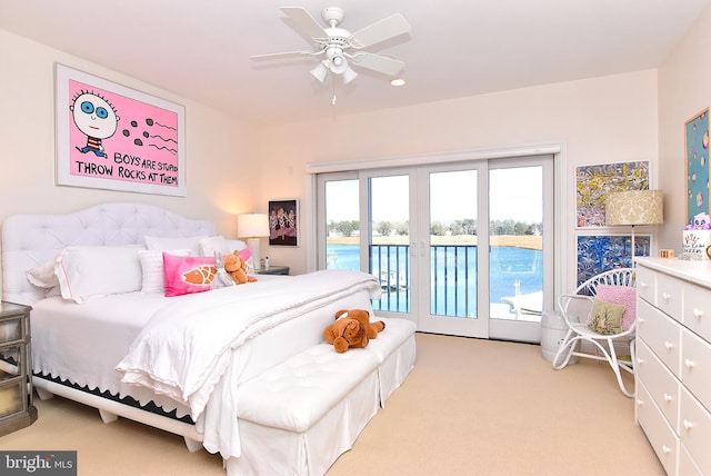 bedroom featuring ceiling fan, access to exterior, and light colored carpet