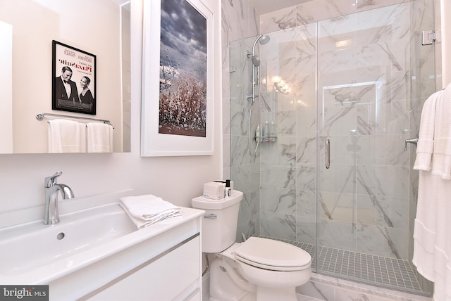 bathroom with vanity, toilet, and walk in shower