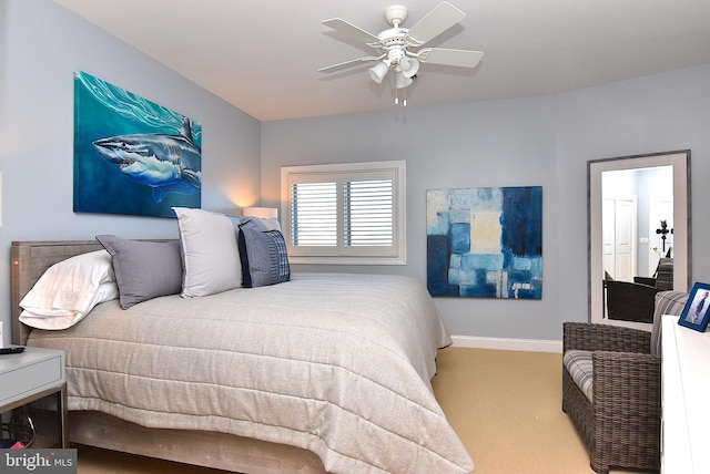 carpeted bedroom with ceiling fan