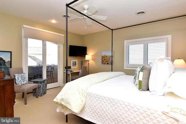 bedroom with ceiling fan, access to outside, and light carpet