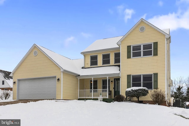 view of front of property with a porch, central air condition unit, and a garage