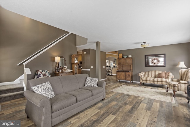 living room with dark hardwood / wood-style floors