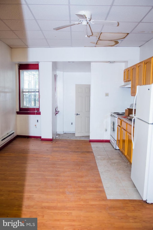 kitchen featuring ceiling fan, white appliances, light wood-type flooring, and a drop ceiling