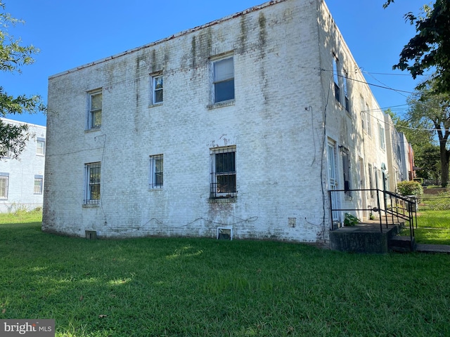 view of home's exterior featuring a yard