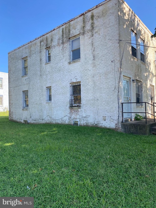 view of home's exterior featuring a lawn