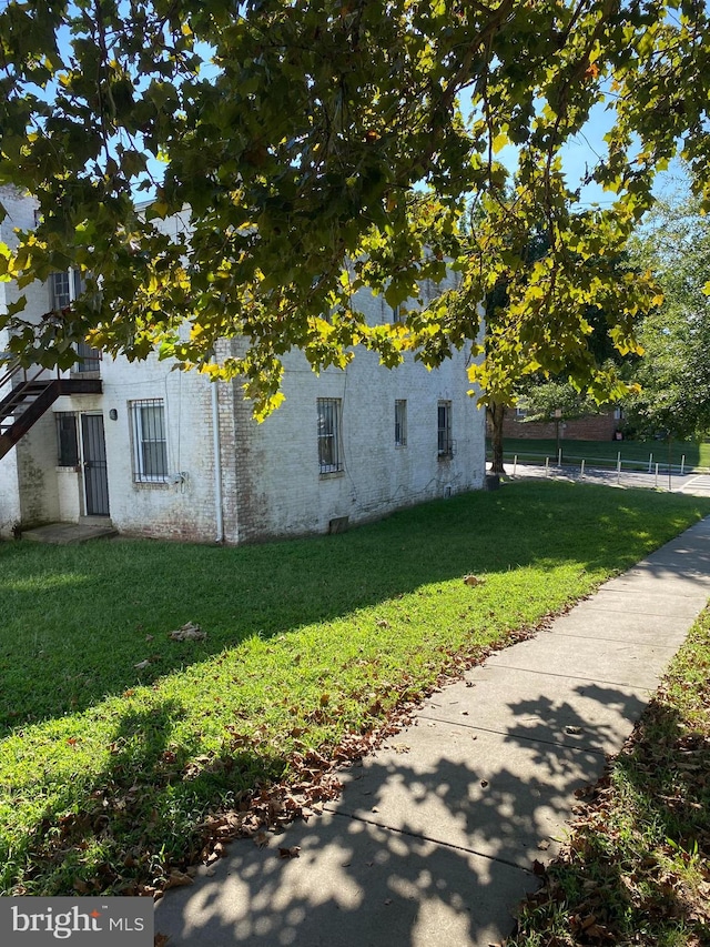 view of home's exterior featuring a lawn