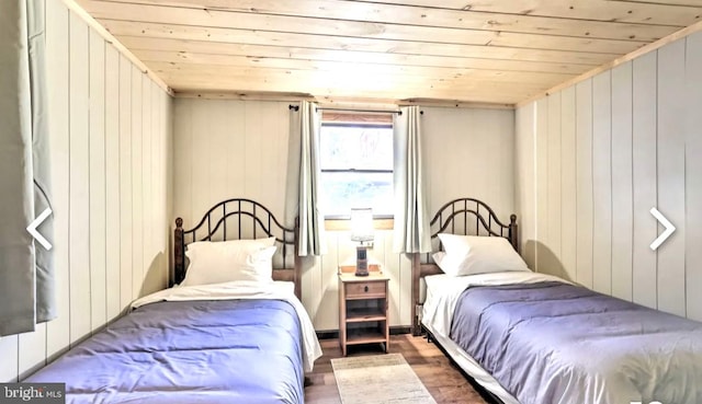 bedroom featuring dark hardwood / wood-style floors and wooden ceiling