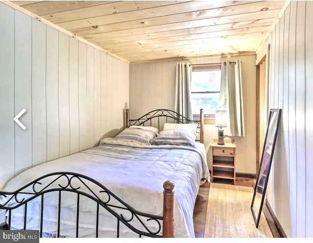 bedroom featuring wood ceiling and hardwood / wood-style floors