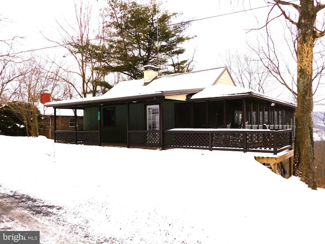 view of snow covered house