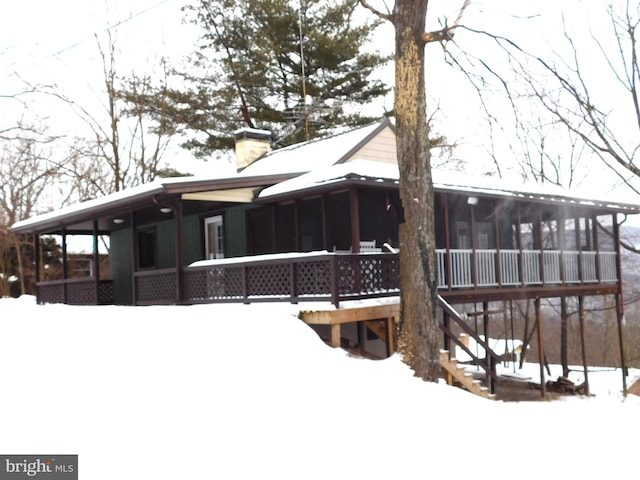 view of snow covered property