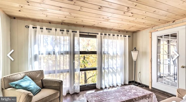 sunroom / solarium with plenty of natural light and wood ceiling