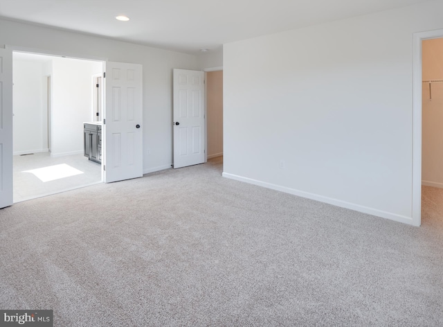 unfurnished room with light carpet