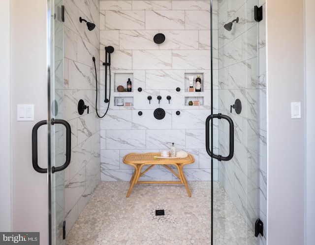 bathroom with a shower with shower door