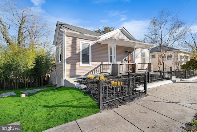 bungalow-style home featuring a porch and a front yard