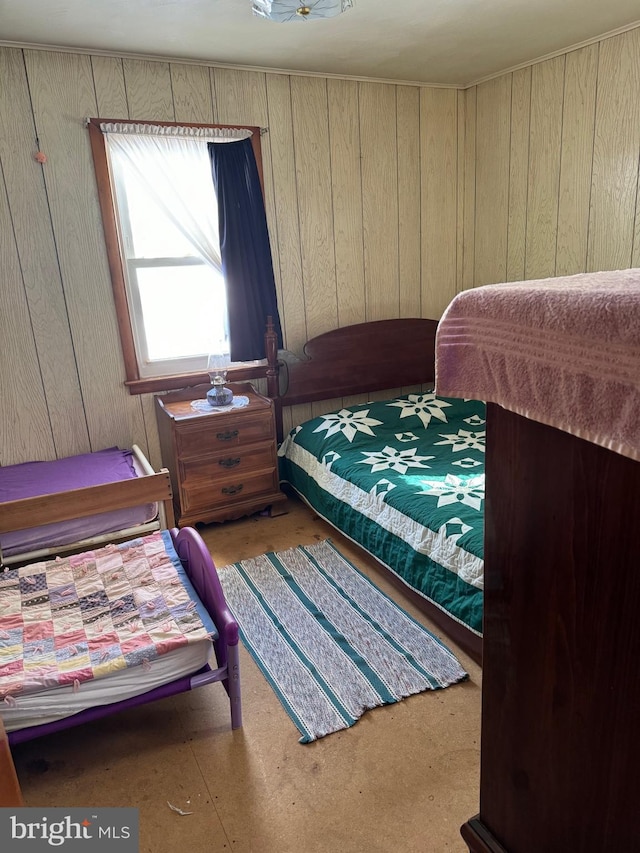 bedroom with wooden walls