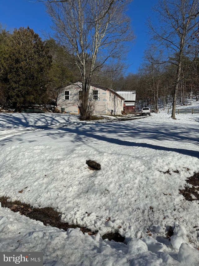 view of yard layered in snow