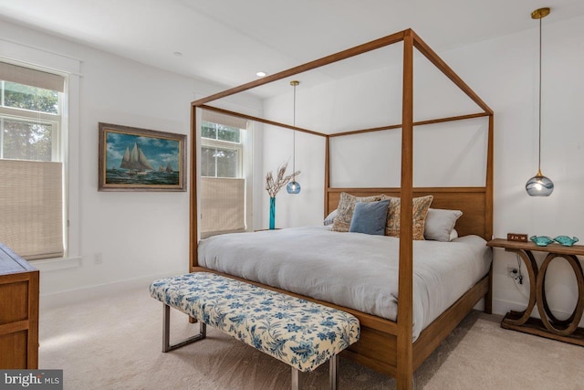 bedroom with light colored carpet