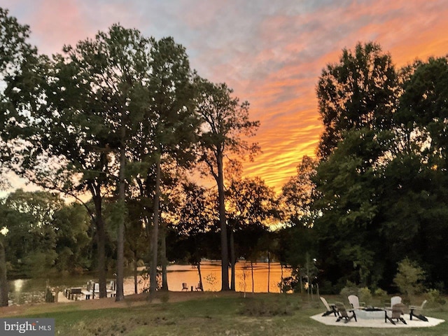 yard at dusk with a water view