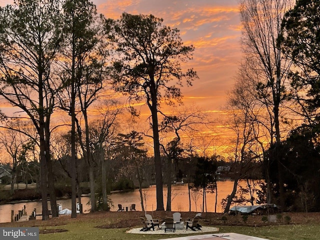 yard at dusk with a water view