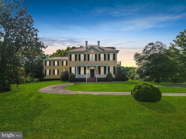 view of front of home with a lawn