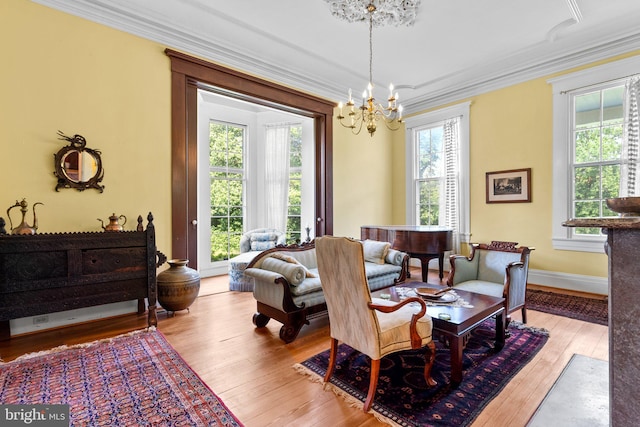 dining room with a chandelier, a wealth of natural light, and light hardwood / wood-style flooring