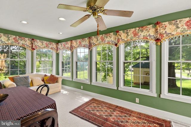 sunroom with ceiling fan and a wealth of natural light