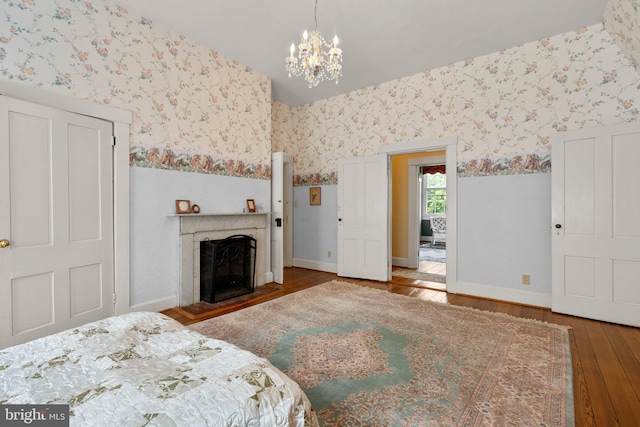 unfurnished bedroom featuring a notable chandelier and dark hardwood / wood-style floors